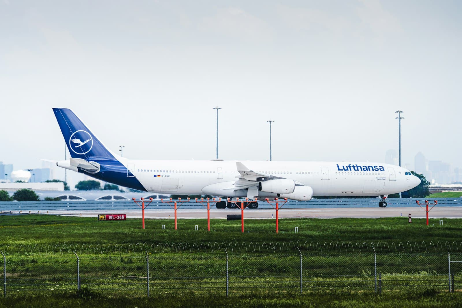 Airliner taxiing on the tarmac in front of an airport terminal